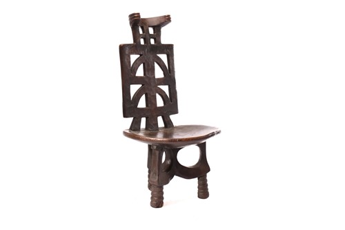 Lot 209 - An Ethiopian chief chair, the pierced back...