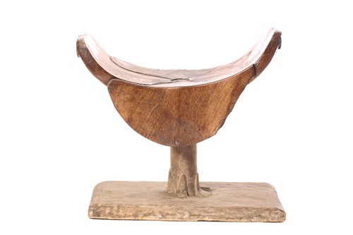 Lot 20 - An Ashanti stool, Ghana, the dished top of...