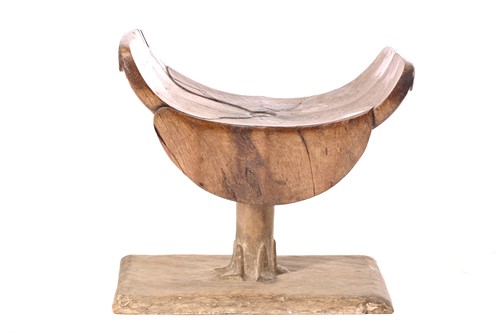 Lot 20 - An Ashanti stool, Ghana, the dished top of...