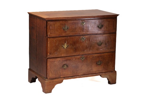 Lot 304 - A Queen Anne walnut and oak chest of four long...