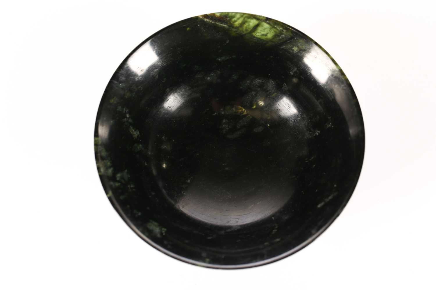 Lot 133 - An Eastern black/green circular Bowenite bowl...
