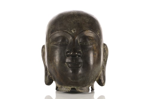 Lot 149 - A Chinese patinated bronze head of the Buddha...