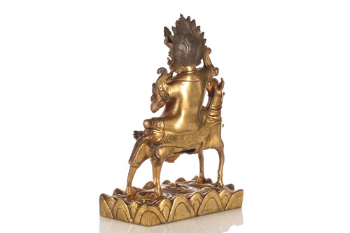 Lot 111 - A Sino-Tibetan gilt-bronze figure of Palden...