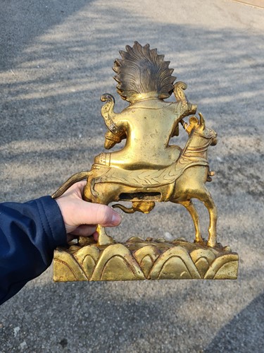 Lot 111 - A Sino-Tibetan gilt-bronze figure of Palden...