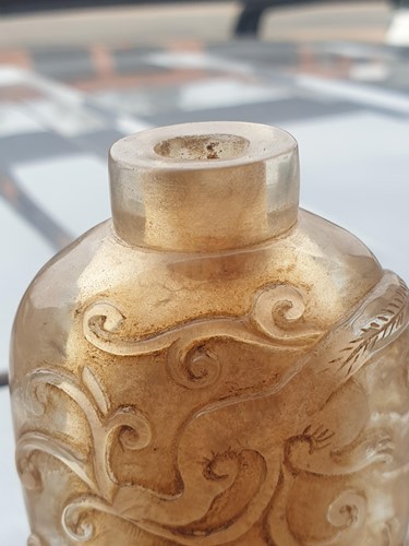 Lot 110 - A Chinese carved rock crystal snuff bottle...