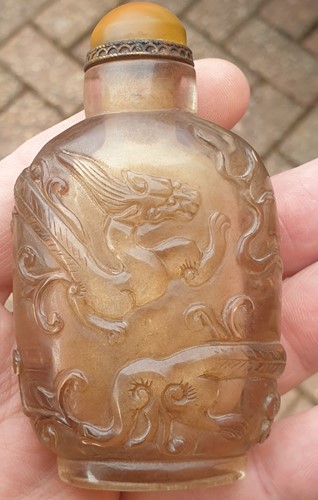 Lot 110 - A Chinese carved rock crystal snuff bottle...