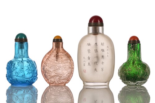 Lot 139 - A collection of Chinese carved glass snuff...