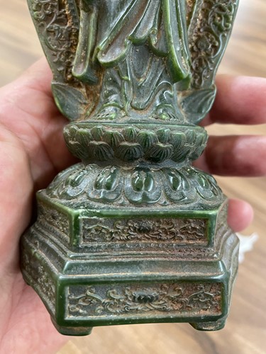 Lot 116 - A Chinese carved dark green jadeite figure of...