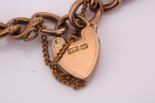 Lot 148 - A 9ct gold bracelet with a heart padlock,...