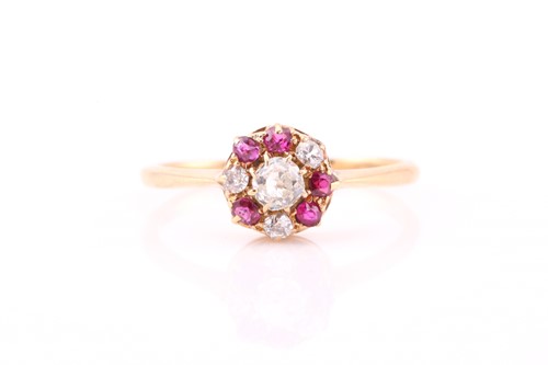 Lot 201 - A diamond and ruby cluster ring, consisting of...