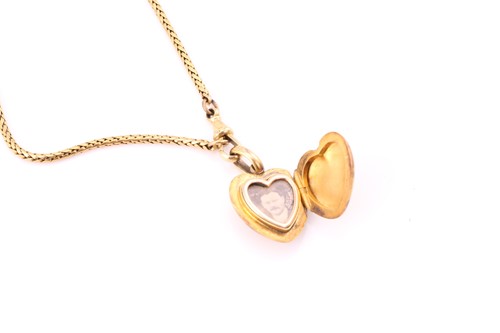 Lot 110 - A diamond set heart-shaped locket and chain,...