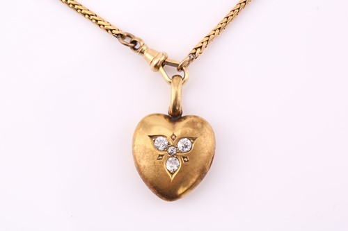 Lot 110 - A diamond set heart-shaped locket and chain,...