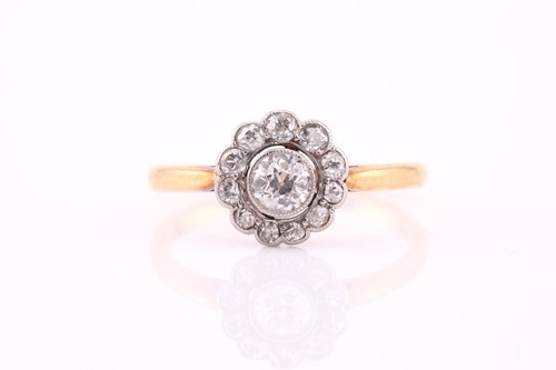 Lot 66 - A yellow metal and diamond daisy-cluster ring,...