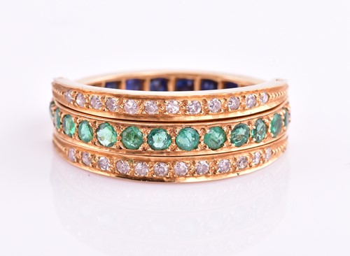 Lot 100 - A diamond, sapphire and emerald swivel ring,...