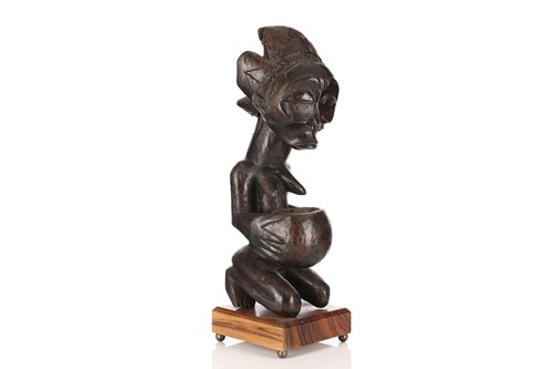 Lot 39 - A large Luba female figure with divination...