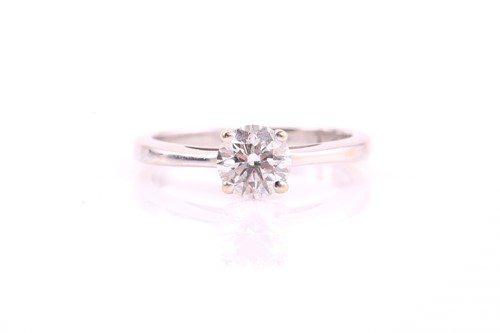 Lot 259 - A single stone diamond ring; the round...