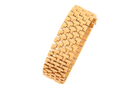 Lot 246 - An 18 carat gold bracelet; the five row...