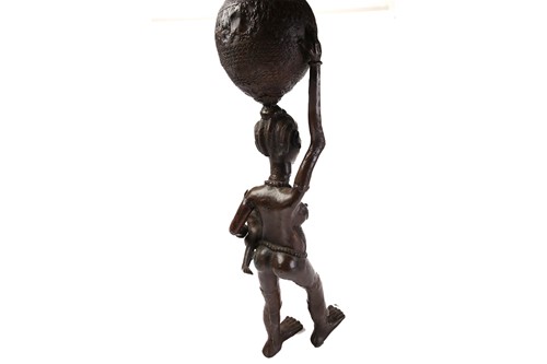 Lot 27 - A large Nigerian bronze standing figure of a...