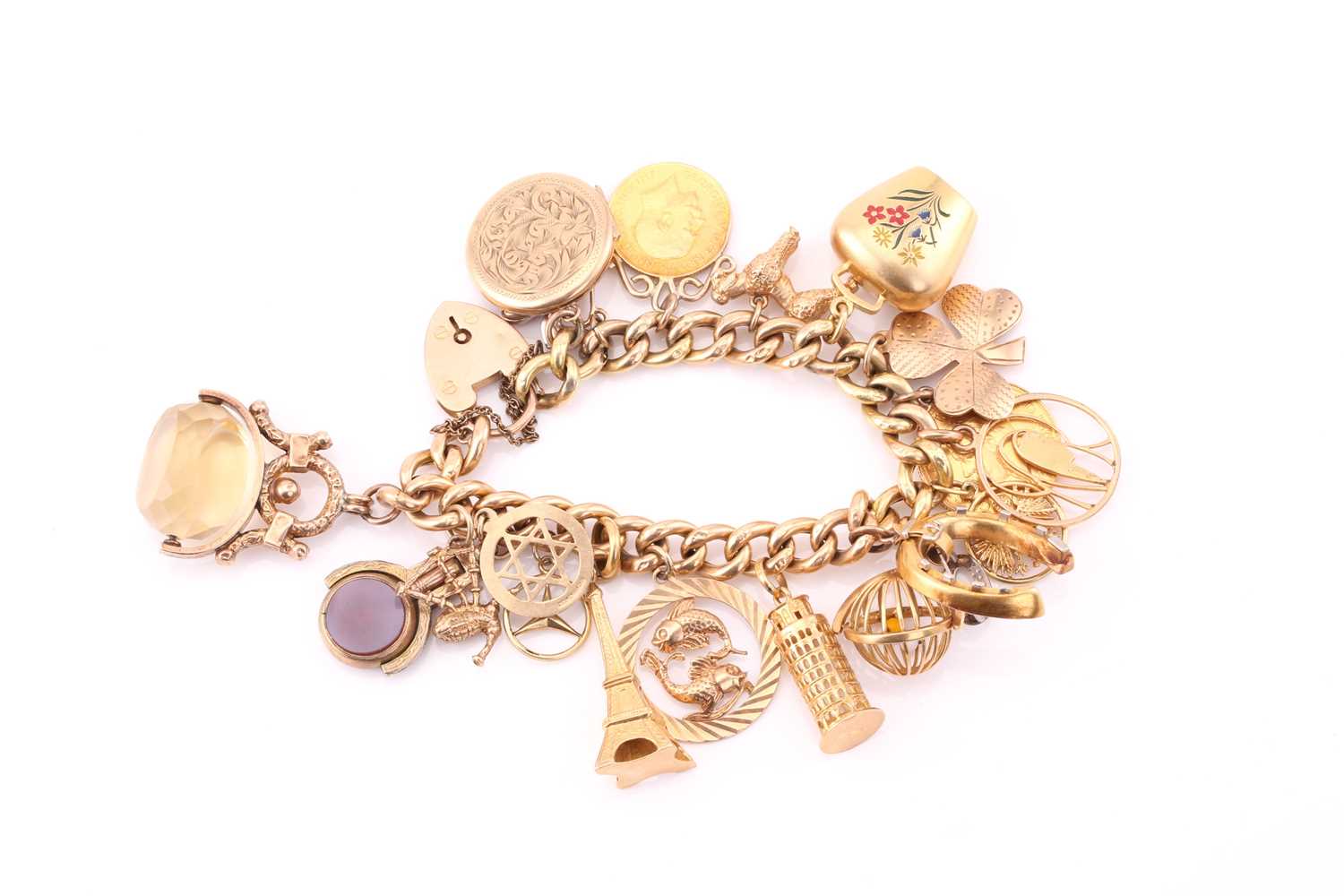 Lot 445 - A yellow gold charm bracelet, consisting of...
