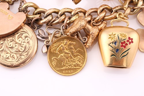 Lot 445 - A yellow gold charm bracelet, consisting of...