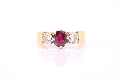 Lot 126 - A ruby and diamond three stone half hoop ring;...