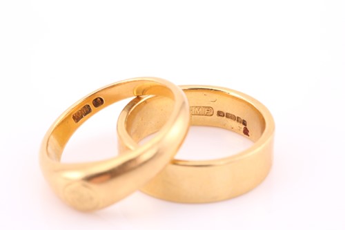 Lot 181 - An 18 carat gold wedding band; wide, angled...