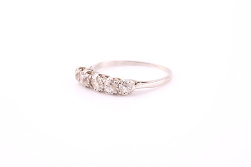 Lot 68 - A five stone half hoop diamond ring, the...