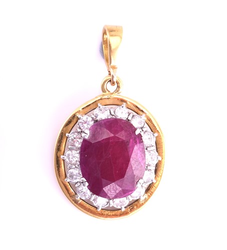 Lot 63 - A ruby entourage converted pendant on chain,...