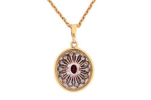 Lot 63 - A ruby entourage converted pendant on chain,...