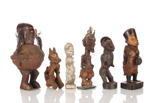 Lot 73 - A group of African standing fetish figures,...