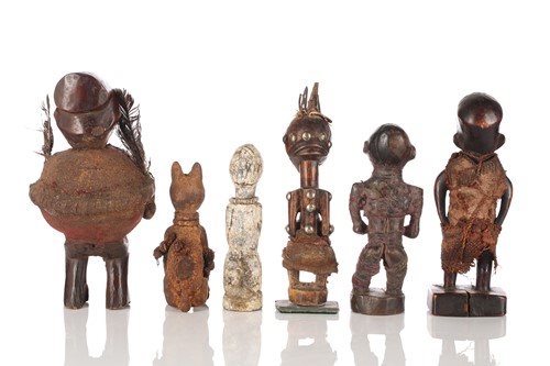 Lot 73 - A group of African standing fetish figures,...