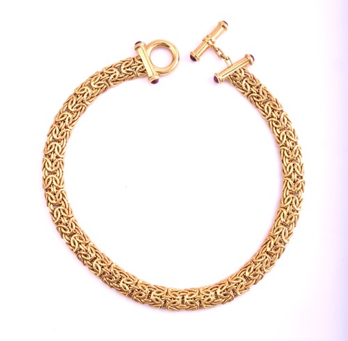 Lot 142 - An 18ct gold and ruby Byzantine chain necklace,...