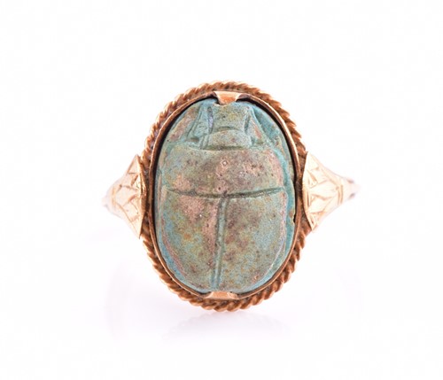 Lot 148 - An Egyptian scarab beetle ring; the antique...