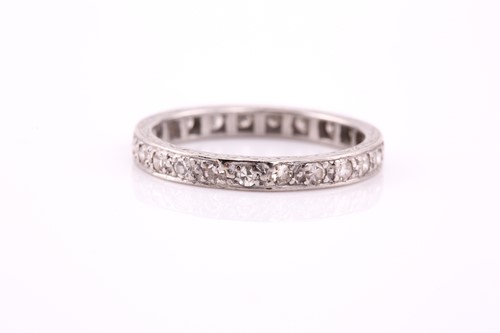 Lot 91 - An Art Deco diamond eternity ring, consisting...