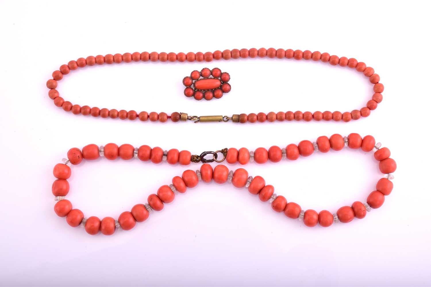 Lot 67 - A lot consisting of a coral necklace, a coral...