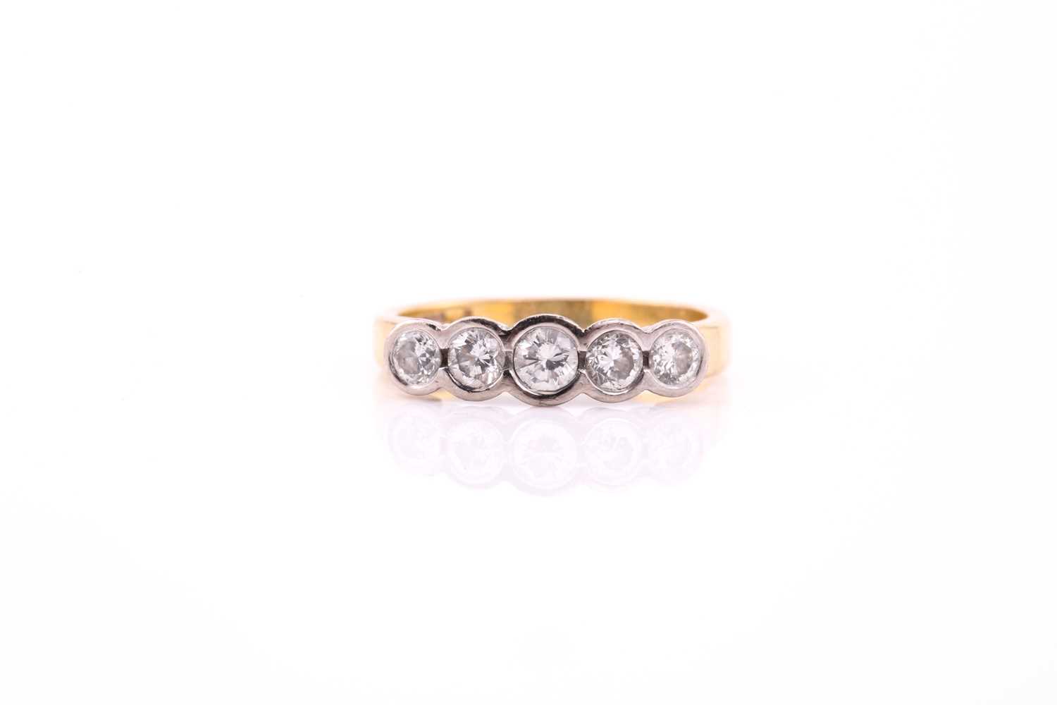 Lot 76 - An 18ct bi-coloured gold diamond ring,...