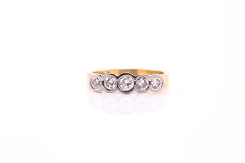 Lot 76 - An 18ct bi-coloured gold diamond ring,...