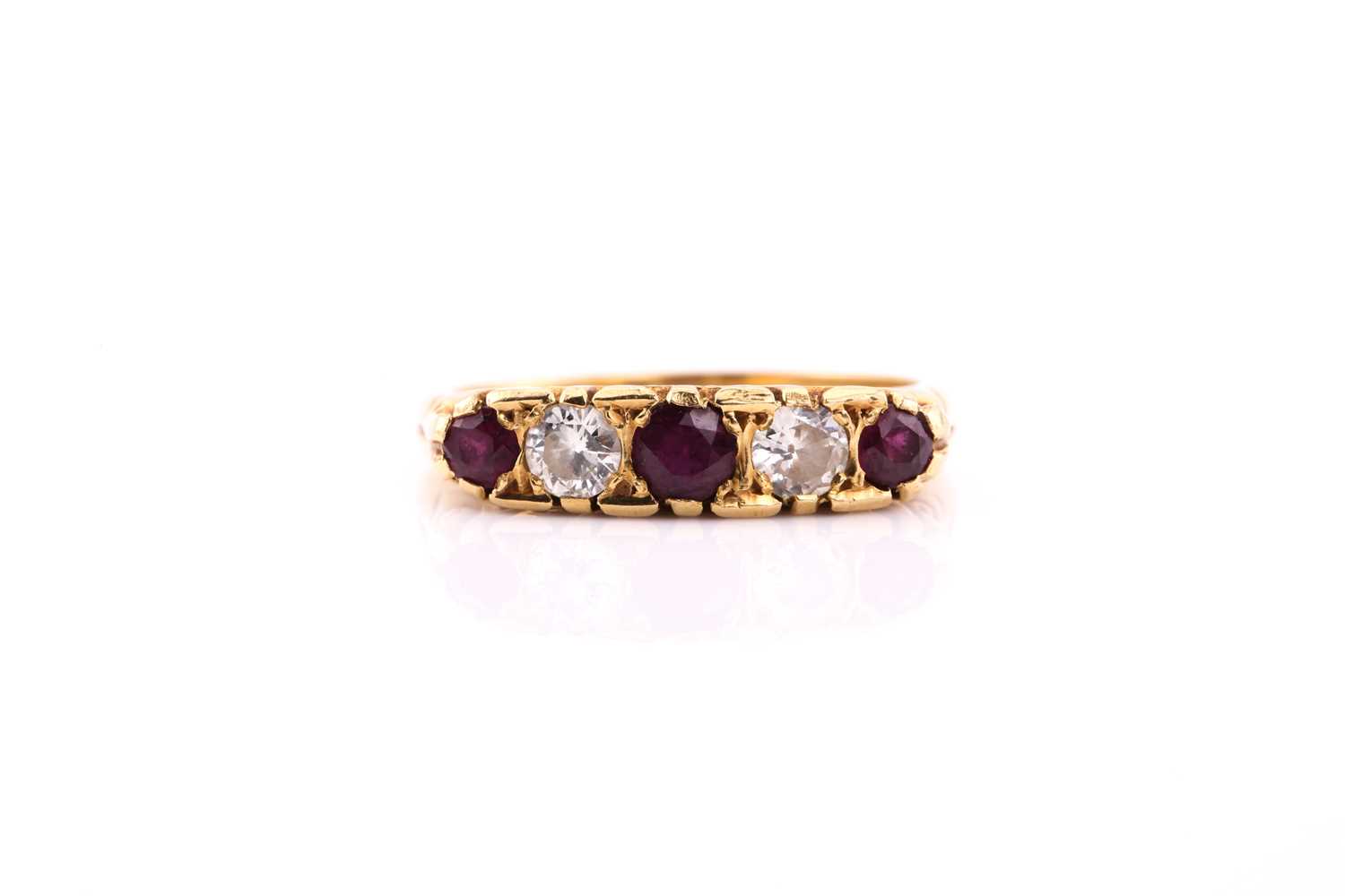 Lot 202 - An 18ct yellow gold five stone ruby and...