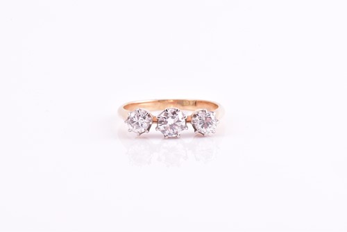 Lot 190 - A three stone diamond ring, the round...