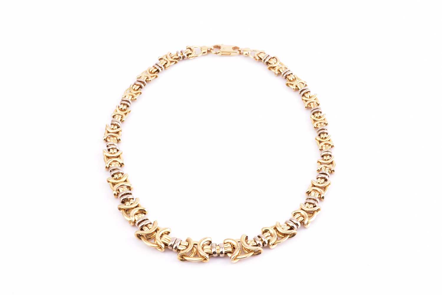 Lot 55 - A graduated fancy knot link necklace, in...
