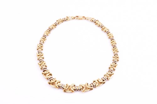 Lot 55 - A graduated fancy knot link necklace, in...