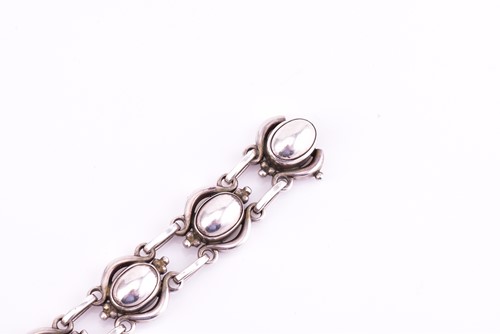 Lot 11 - Georg Jensen - an oval cabochon and scroll...