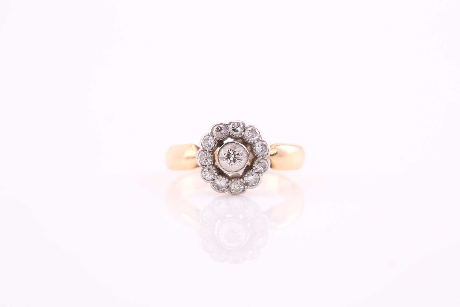 Lot 156 - A diamond cluster ring, central diamond within...
