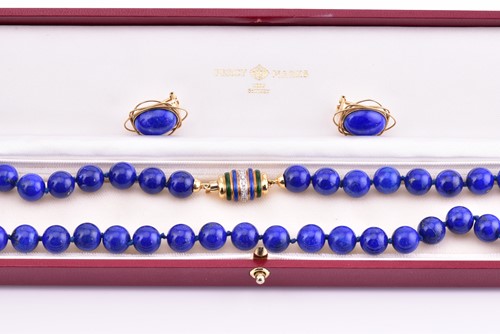 Lot 262 - A lapis lazuli bead necklace, with yellow...