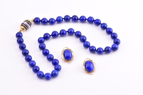 Lot 262 - A lapis lazuli bead necklace, with yellow...