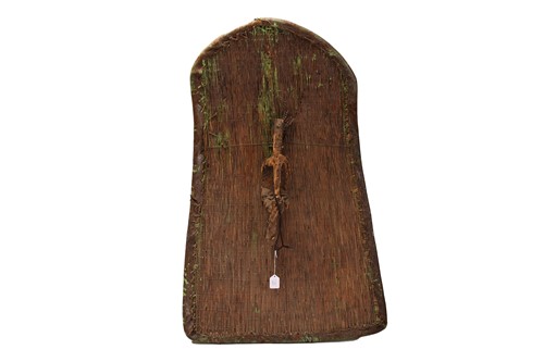 Lot 120 - A West African split cane shield, with hide...