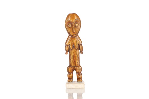 Lot 71 - A Lega carved ivory standing female figure,...
