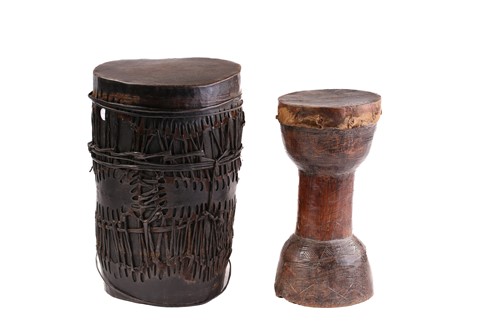 Lot 134 - A West African double-ended drum, the...