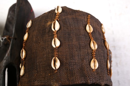 Lot 118 - A We mask, Ivory Coast, with applied shells,...