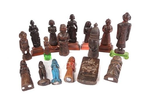 Lot 209 - A collection of Indian carved wood figures,...